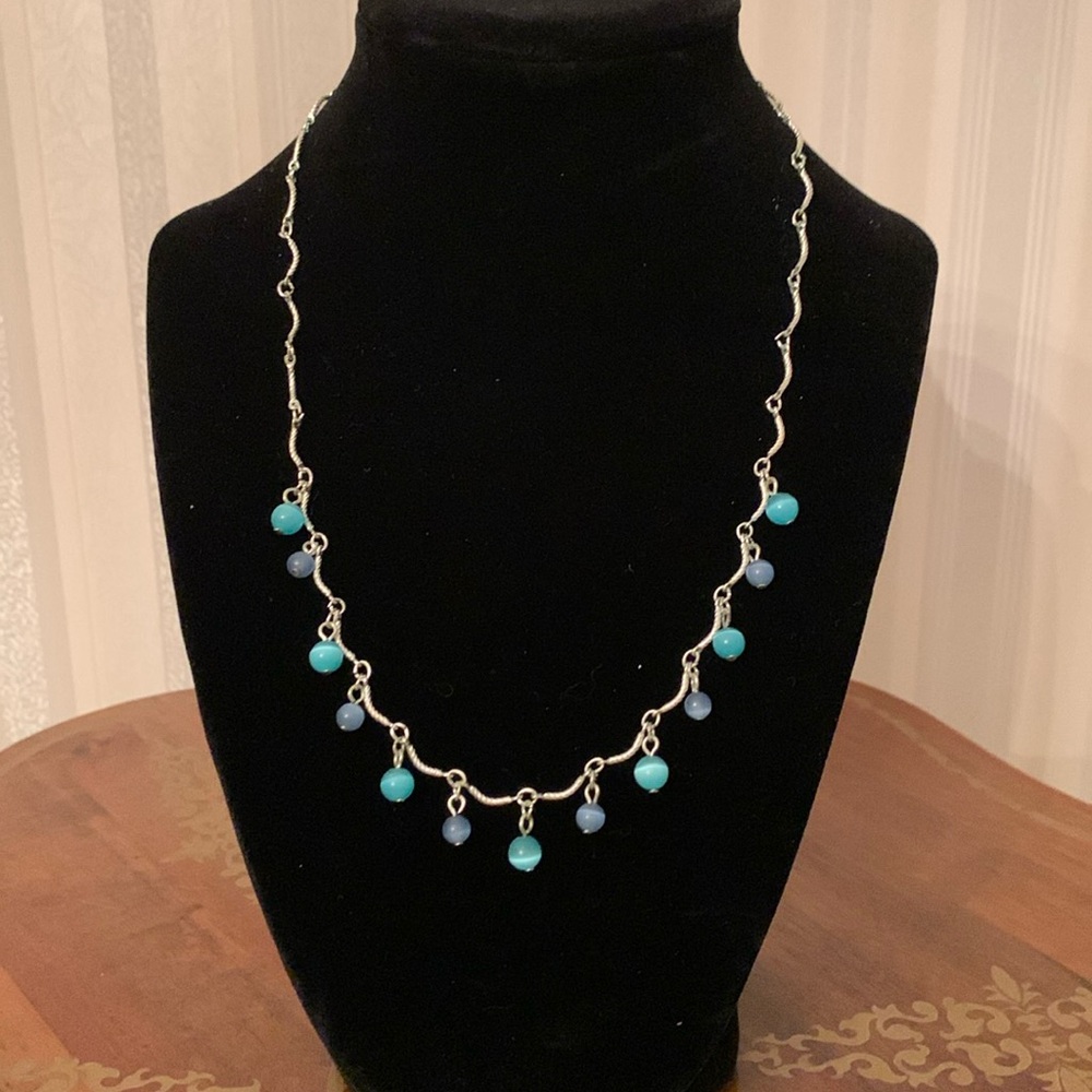 Silver costume necklace with blue beads. 7” from nape to drop, 3” extender.